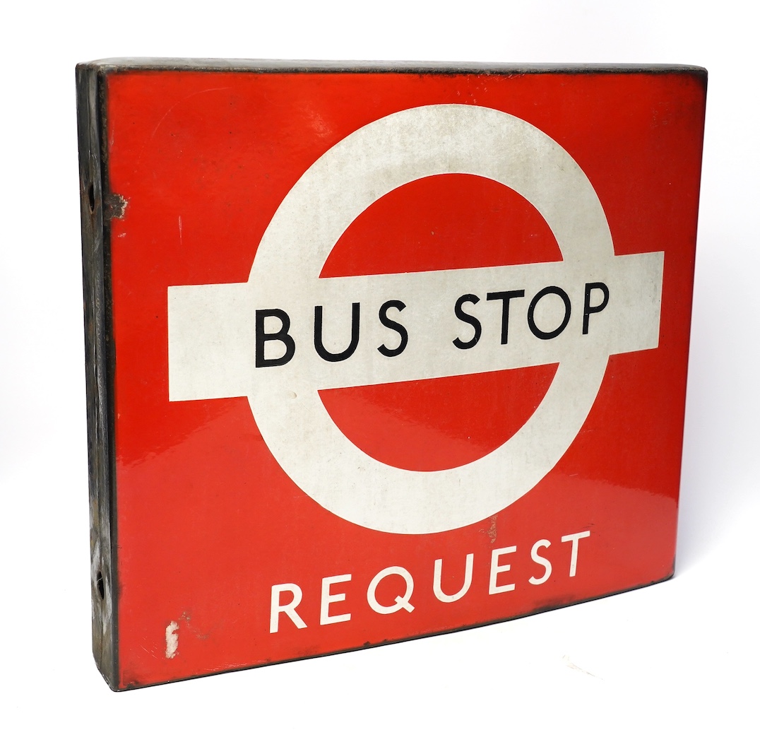 A London Transport double sided enamel Bus Stop Request sign, serial number on applied panel to base; 12137, 40cm high, 46cm wide. Condition - fair to good condition, with minor losses to the edge of the enamel, etc.
